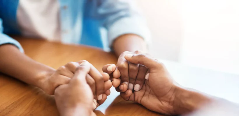 hands clasped palliative care