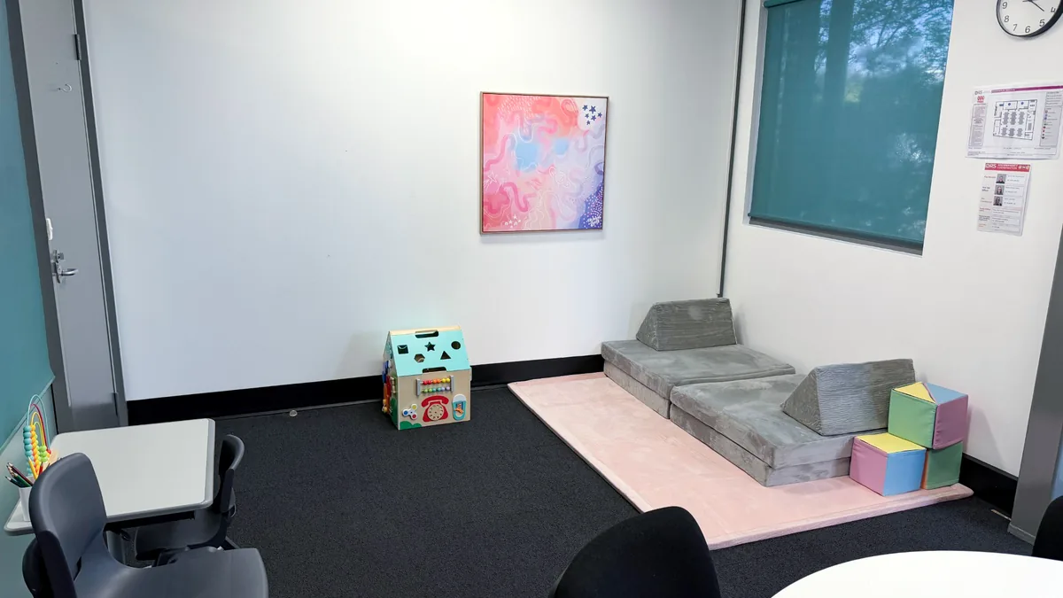 Accessible paediatric therapy room with soft play blocks, a pink play mat and child-sized chairs at ORS Fyshwick