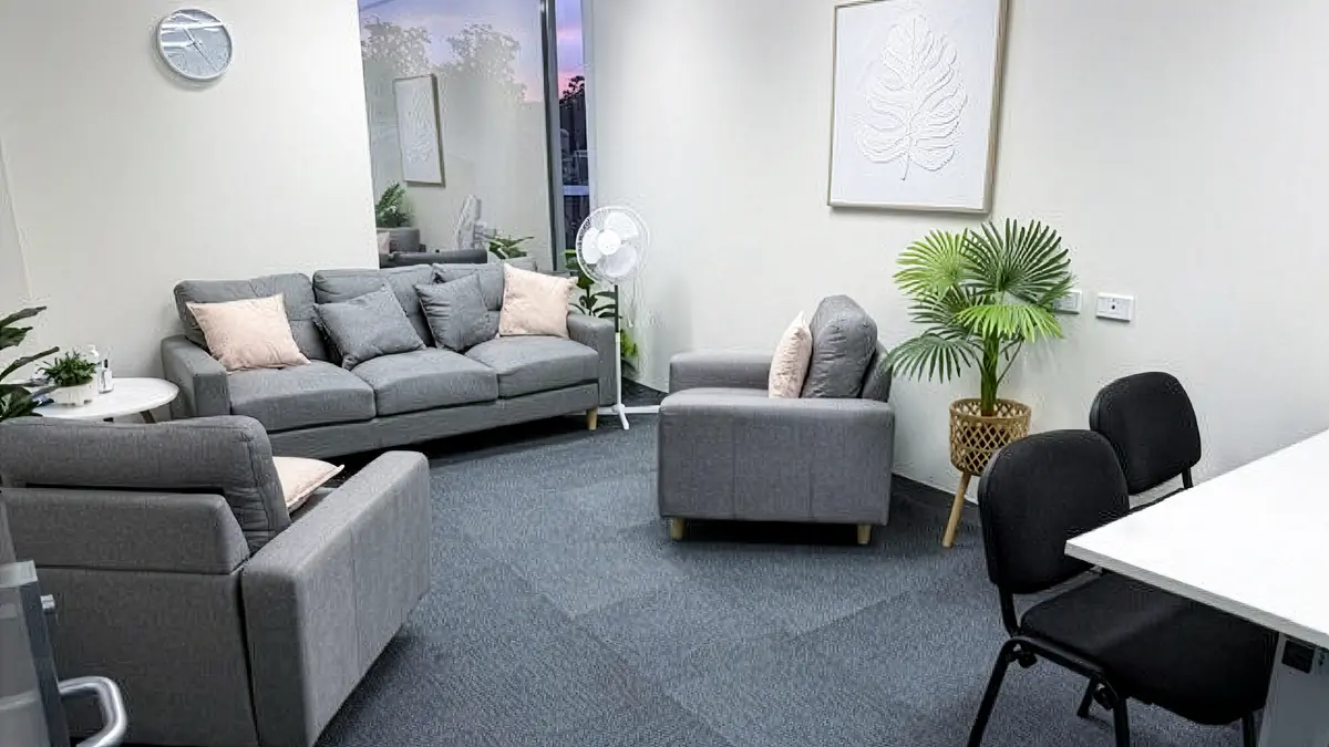 Assessment and counselling room with lounges, armchairs and a clinician desk at ORS Gosford