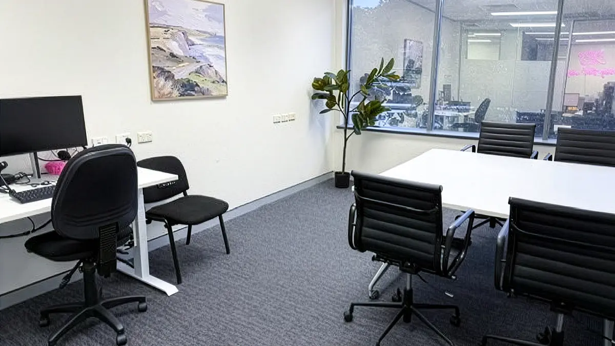 Consulting room with a clinician workstation and meeting table for client appointments at ORS Gosford