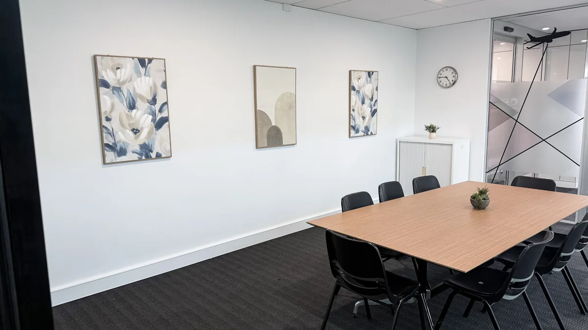 Assessment and training room with a timber meeting table and chairs at ORS Jandakot