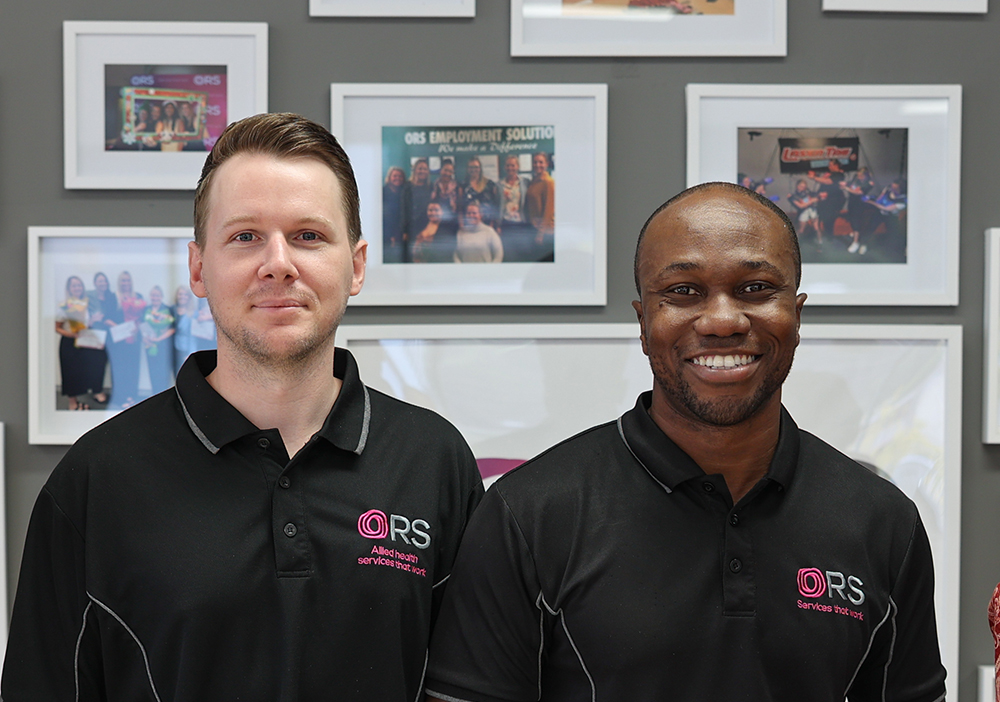two male psychologists smiling